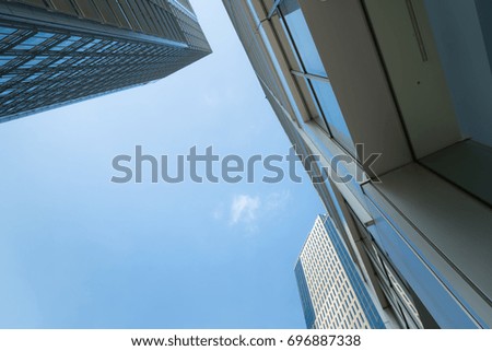 A group of modern skyscrapers in the city with beautiful sky and clouds.