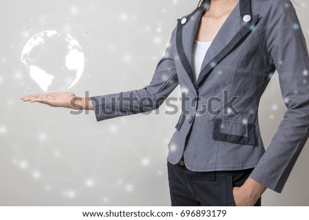 Future of technology network concept,Businessman holding worldwide network symbols and graphical interface.
