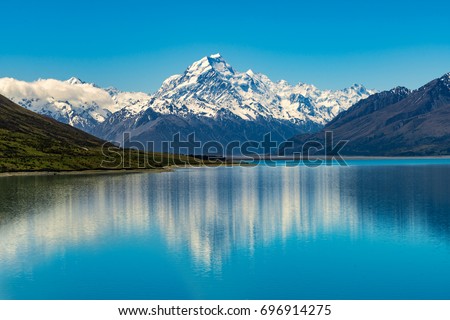 Mount Cook landscape reflection on Lake Pukaki, the highest mountain in New Zealand and popular travel destination. Royalty-Free Stock Photo #696914275
