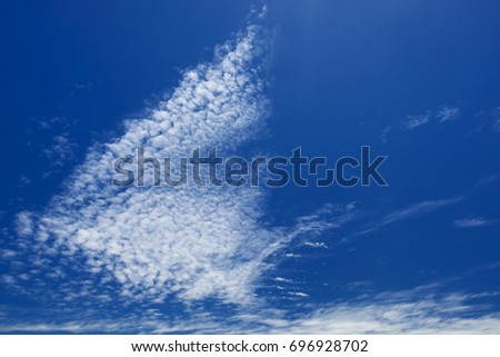 Altocumulus clouds in the blue sky.