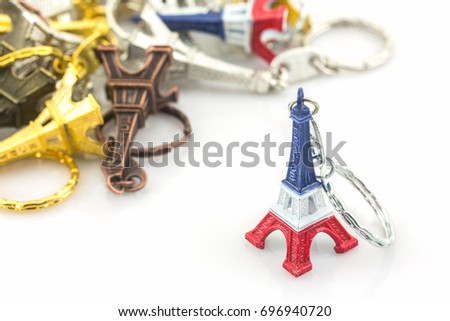 Souvenir key chain of mini eiffel tower (Tour Eiffel) on white background.