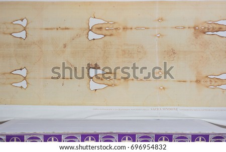 Abstract and conceptual Catholicism, the Holy Shroud of Turin. Known as the Holy Shroud, or Holy Shroud is a linen cloth kept in Turin Cathedral. The Christian tradition and the body in the tomb. Royalty-Free Stock Photo #696954832