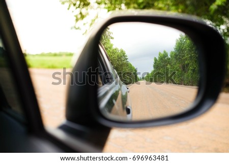 wing mirror of black car. See the way passed.
