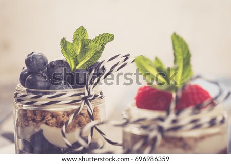 Parfait. Raspberries and blueberries with greek yogurt and granola