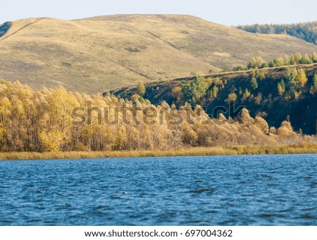 Russia Tatarstan Kama River Fall. Multi-coloured fall foliage along a river. 