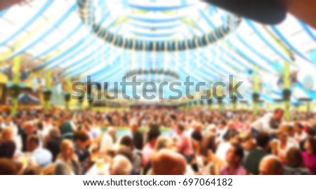 Blur_People enjoy live music and drinking beer during October festival in munich (München), Germany Royalty-Free Stock Photo #697064182