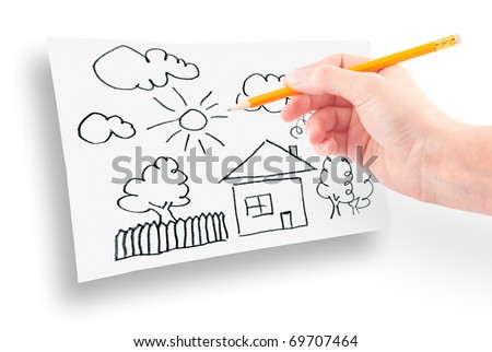 woman's hand with the pencil drawing the dream home on a white sheet of paper