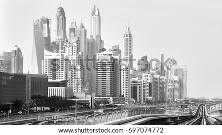 Old black and white film style picture of Dubai skyline, United Arab Emirates.