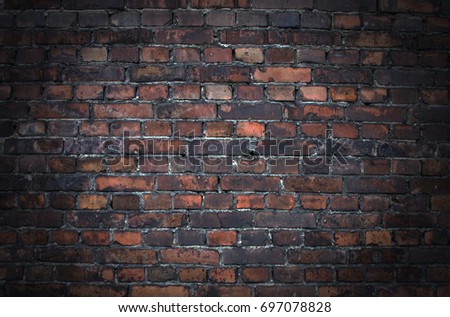 Texture red brick wall grunge background effect with vignetted corners
