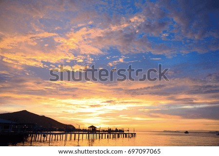 Sunset and jetty at Thailand beach