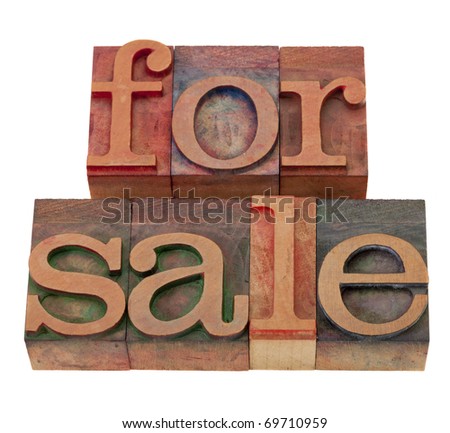 for sale phrase in vintage wooden letterpress printing blocks, stained by color inks, isolated on white