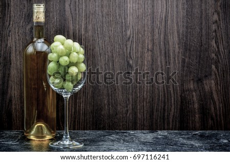 winebottle and glas with grape close up