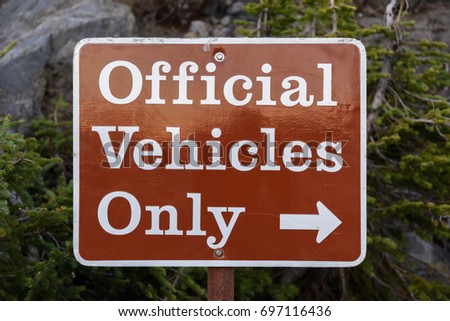 Red Sign saying Official Vehicles only