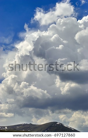 Blue sky and cumulus clouds over Mount Erciyes in Cappadocia, Turkey