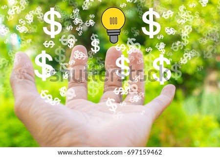 Man hand with lamp, dollar vector on tree blurry background. using wallpaper or background for education, business photo. Take note of the product for book with paper and concept or copy space.