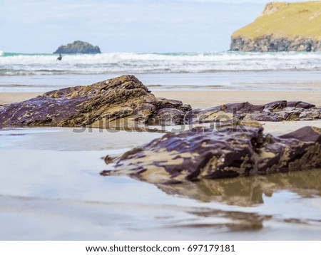Long exposure of waves rushing over rocks
