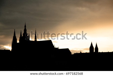 Czech Republic capital city Praga evening sunset view, statues and churches of old city panorama, background picture with saint elements Karlov bridge Cross
