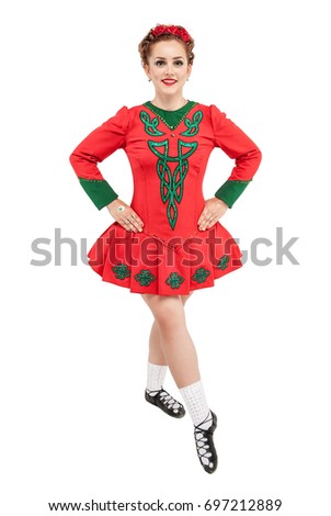 Beautiful woman in red dress for Irish dance isolated on white