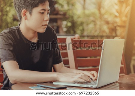 woman using smartphone  and credit card shopping online. vintage color tone