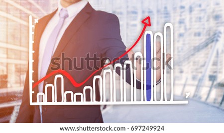 View of a Businessman touching technology interface with financial curve and graph