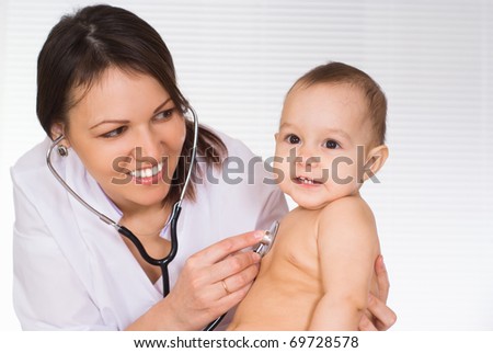 beautiful doctor with newborn on a white background
