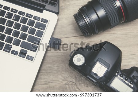 Devices used to record images, notebooks, cameras and lenses.