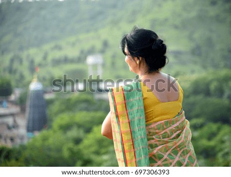Beautiful Indian Woman in a Sari at outdoors
