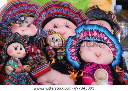 Dolls with the typical outfits of the Cusco region, in the central market of San Pedro, Peru Royalty-Free Stock Photo #697345393