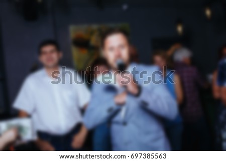 Abstract blurred background of people at a banquet