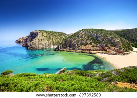 Cala Domestica beach, Sardinia, Italy. Sardinia is the second largest island in mediterranean sea.  Royalty-Free Stock Photo #697392580