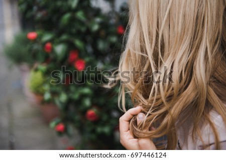 Blonde hair. Blonde woman. Back View. Lifistyle