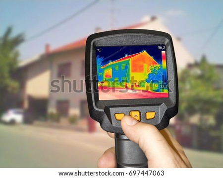 Recording Heat Loss at the House With Infrared Thermal Camera Royalty-Free Stock Photo #697447063