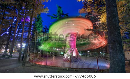 Amusement park at night horse retro carousel attraction