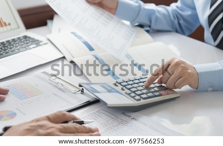 Business analyst team checking in financial statement for audit internal control system. Accounting , Accountancy  Concept. Royalty-Free Stock Photo #697566253