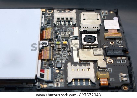 Photo image. Close up of smart phone internal hardware. Cellphone repair process illustration