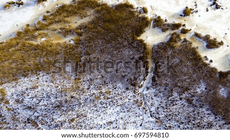 aerial view of frozen forest lake in winter. drone photography. abstract texture - panoramic image