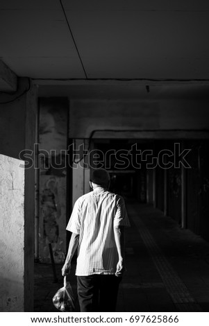 A man walking home after shopping in the market 