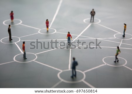 social network service concept(sns): connected miniature people on blackboard  Royalty-Free Stock Photo #697650814