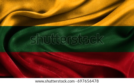 Realistic flag of Lithuania on the wavy surface of fabric. This flag can be used in design