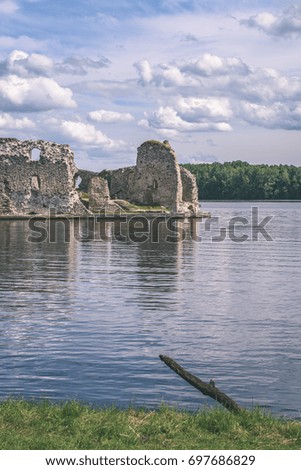 old stone castle ruins in Koknese, Latvia. hot summer day - vintage pastel color effect