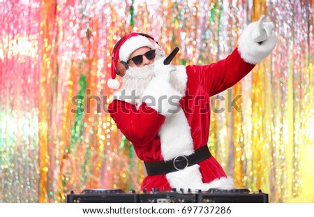 DJ Santa Claus playing music in club