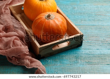 Photo of two orange pumpkins