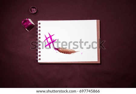 fusion of traditional manual hard print copy handwriting with ink and feather and digital writing sign symbol # hashtag social networking symbol