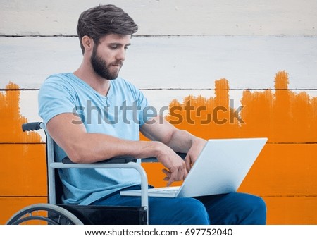 Digital composite of Disabled man in wheelchair with bright painted orange background