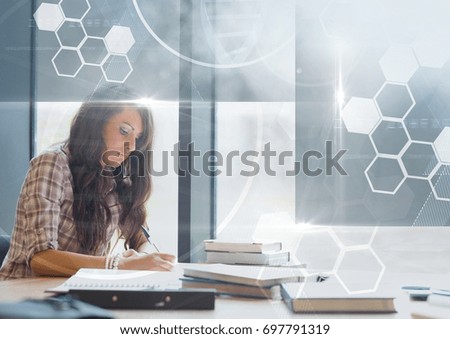 Digital composite of Female Student studying with notes and science education interface graphics overlay