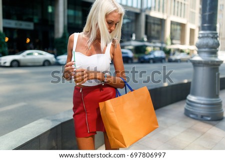 Photo of woman with packages