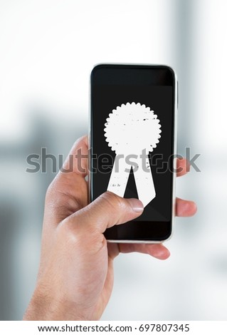 Digital composite of Person holding a phone with a trophy icon