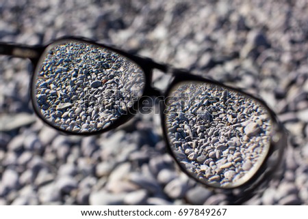Stones through glasses