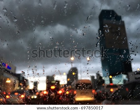 Traffic jam  on a rainy day. Closeup dark cloud
