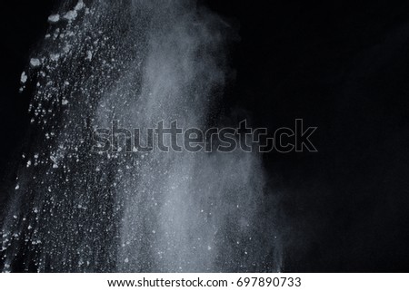 abstract powder splatted background,Freeze motion of color powder exploding/throwing color powder,color glitter texture on black background

